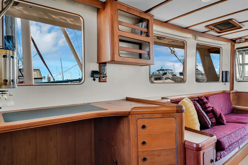 Slide: The Image of Interior of 1991 TransWorld Fantail 50 Motor Yacht with wooden cabinetry and seating. - 7