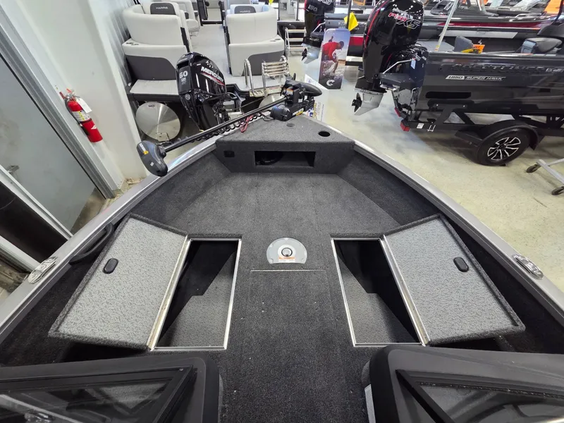 Slide: The Image of Interior view of 2026 Crestliner 1650 Hawk boat with storage compartments. - 10