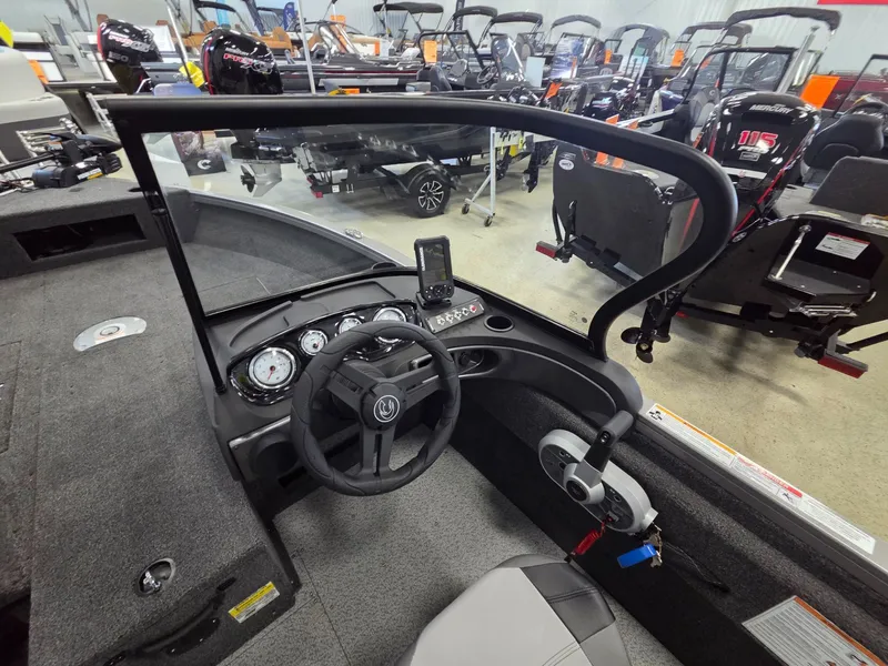 Slide: The Image of Interior view of 2026 Crestliner 1650 Hawk boat in showroom. - 14