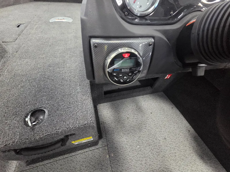 Slide: The Image of Interior of 2026 Crestliner 1650 Hawk with dashboard and carpeted flooring. - 15