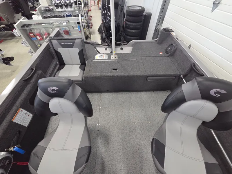 Slide: The Image of Interior of 2026 Crestliner 1650 Hawk boat with gray seating. - 17