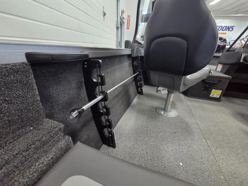 Slide: The Image of Interior of 2026 Crestliner 1650 Hawk with seat and fishing rod holder. - 21