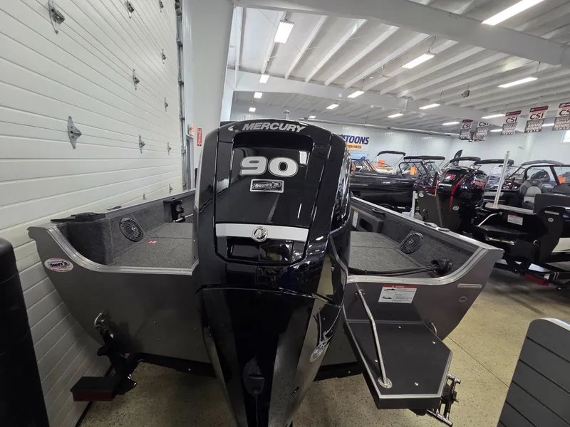 Slide: The Image of 2026 Crestliner 1650 Hawk with Mercury 90 HP engine in showroom. - 4