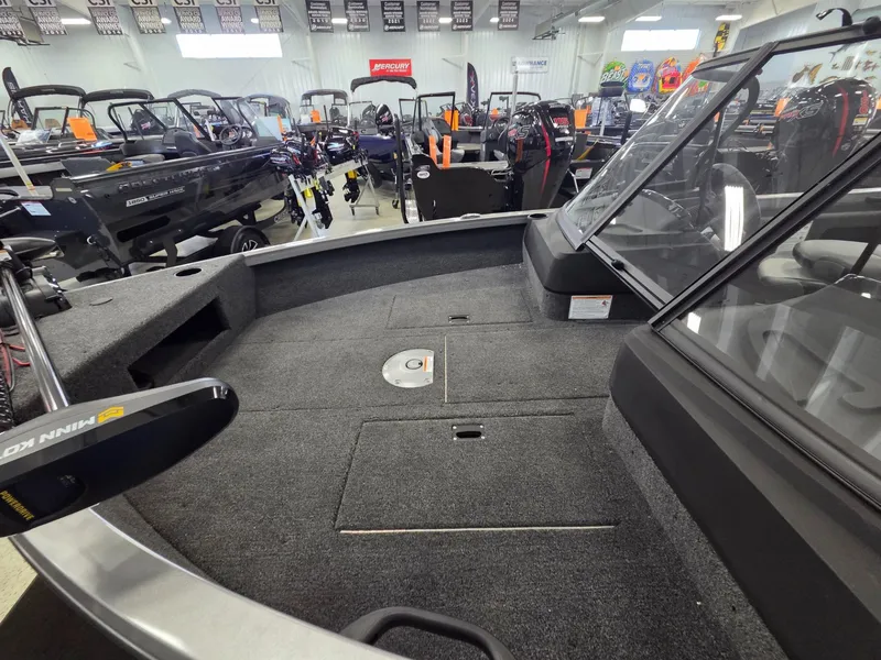 Slide: The Image of Interior view of 2026 Crestliner 1650 Hawk boat in showroom. - 7