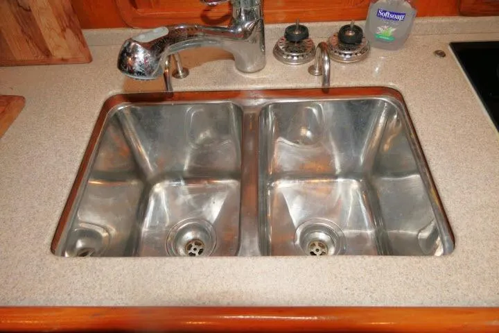 Slide: The Image of Stainless steel double sink in 2002 Tayana 460 Vancouver Pilothouse kitchen. - 17