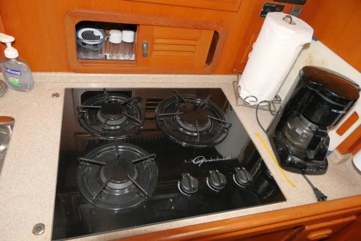 Slide: The Image of Galley kitchen in 2002 Tayana 460 Vancouver Pilothouse with stove and coffee maker. - 19