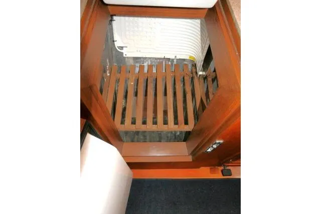 Slide: The Image of 2002 Tayana 460 Vancouver Pilothouse interior with wooden hatch and storage area. - 20