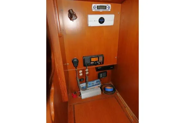 Slide: The Image of Control panel in 2002 Tayana 460 Vancouver Pilothouse, featuring navigation and communication equipment. - 22