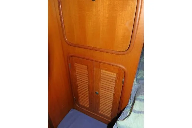 Slide: The Image of Wooden interior of 2002 Tayana 460 Vancouver Pilothouse, featuring cabinet doors. - 26