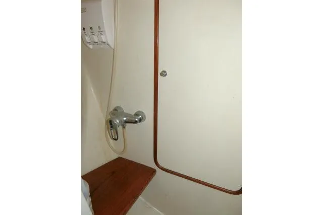 Slide: The Image of Interior of 2002 Tayana 460 Vancouver Pilothouse, featuring a compact shower area. - 33
