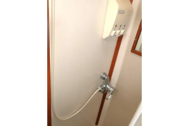 Slide: The Image of Shower area in 2002 Tayana 460 Vancouver Pilothouse yacht with wall-mounted dispenser. - 43