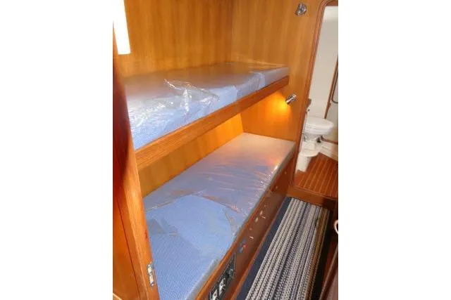 Slide: The Image of Bunk beds in 2002 Tayana 460 Vancouver Pilothouse with adjacent bathroom. - 44
