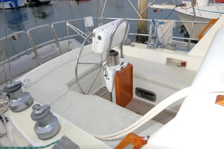 Slide: The Image of 2002 Tayana 460 Vancouver Pilothouse yacht cockpit with steering wheel and winches. - 48