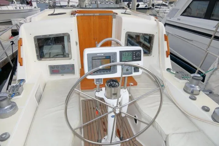 Slide: The Image of Pilothouse of 2002 Tayana 460 Vancouver yacht with navigation equipment and steering wheel. - 54