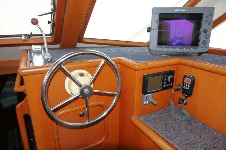 Slide: The Image of Pilothouse of 2002 Tayana 460 Vancouver with steering wheel and navigation equipment. - 6