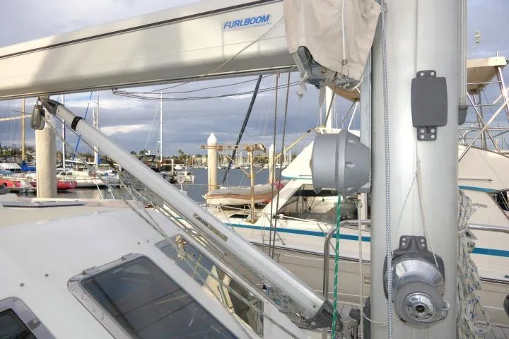 Slide: The Image of 2002 Tayana 460 Vancouver Pilothouse sailboat mast and rigging in marina setting. - 61