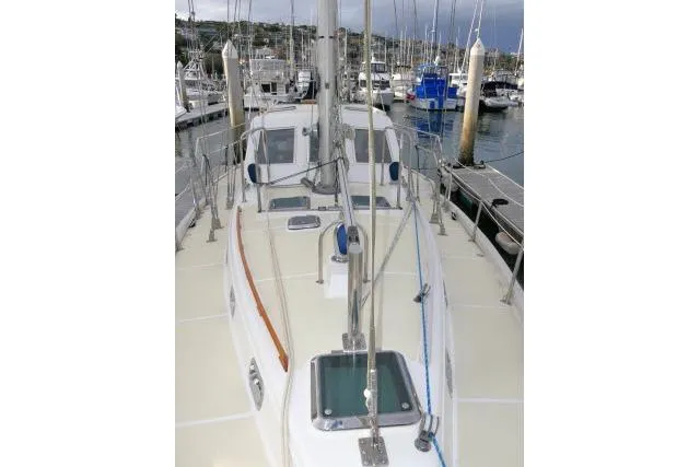 Slide: The Image of 2002 Tayana 460 Vancouver Pilothouse sailboat docked in a marina. - 66
