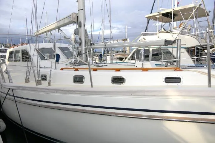 Slide: The Image of 2002 Tayana 460 Vancouver Pilothouse yacht docked at marina, side view. - 69