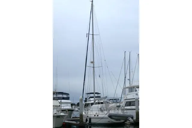 Slide: The Image of 2002 Tayana 460 Vancouver Pilothouse sailboat docked among other vessels. - 82
