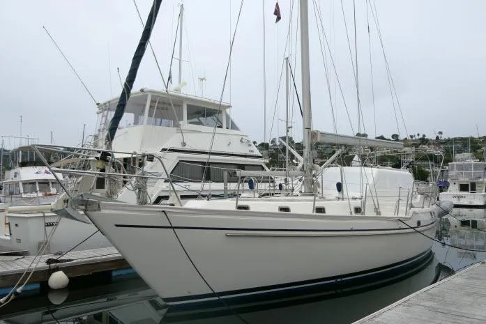 Slide: The Image of 2002 Tayana 460 Vancouver Pilothouse yacht docked in a marina. - 85