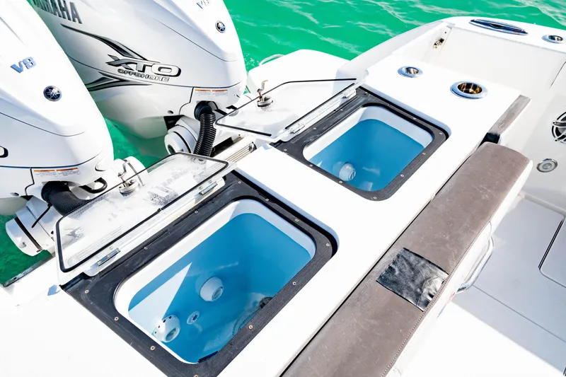 Slide: The Image of 2022 Crevalle 33 CSF boat with Yamaha XTO V8 engines and livewell compartments. - 11