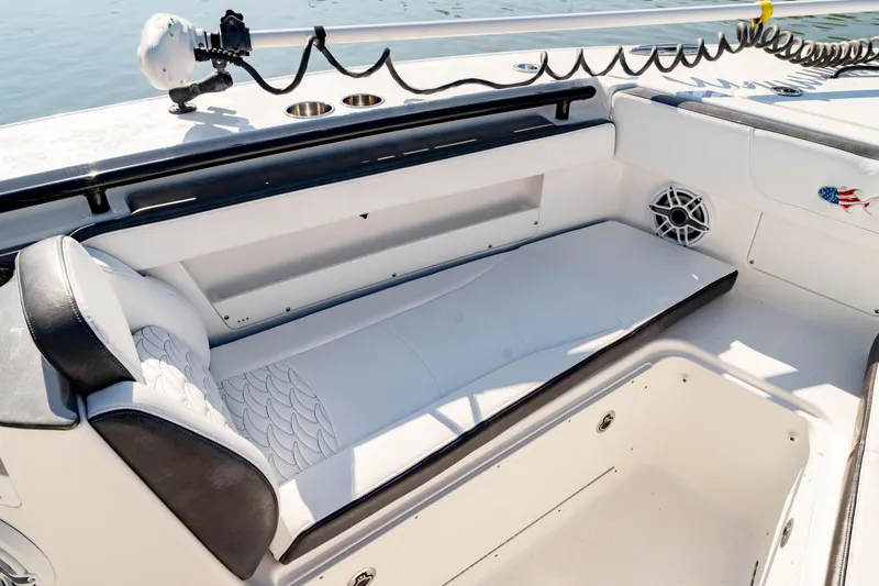 Slide: The Image of 2022 Crevalle 33 CSF boat interior with cushioned seating and speaker. - 12
