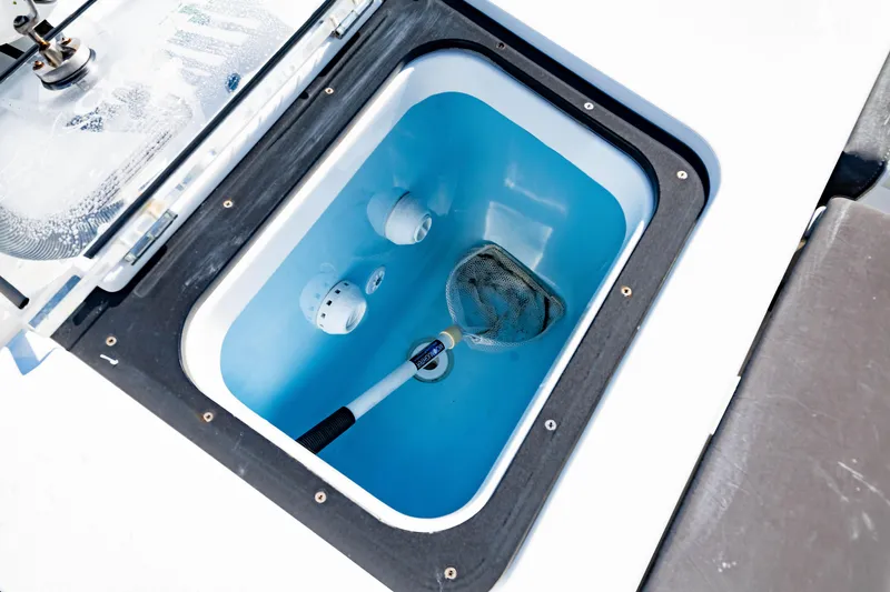 Slide: The Image of Livewell compartment on 2022 Crevalle 33 CSF boat with net inside. - 15