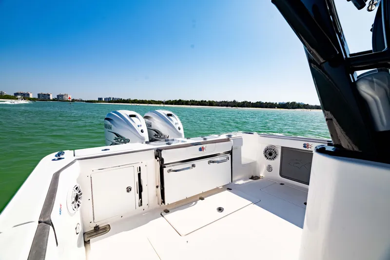 Slide: The Image of 2022 Crevalle 33 CSF boat with dual Yamaha engines on a sunny day. - 18