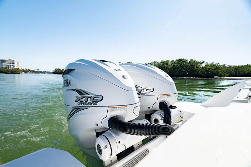 Slide: The Image of 2022 Crevalle 33 CSF with twin Yamaha XTO Offshore engines on water. - 2