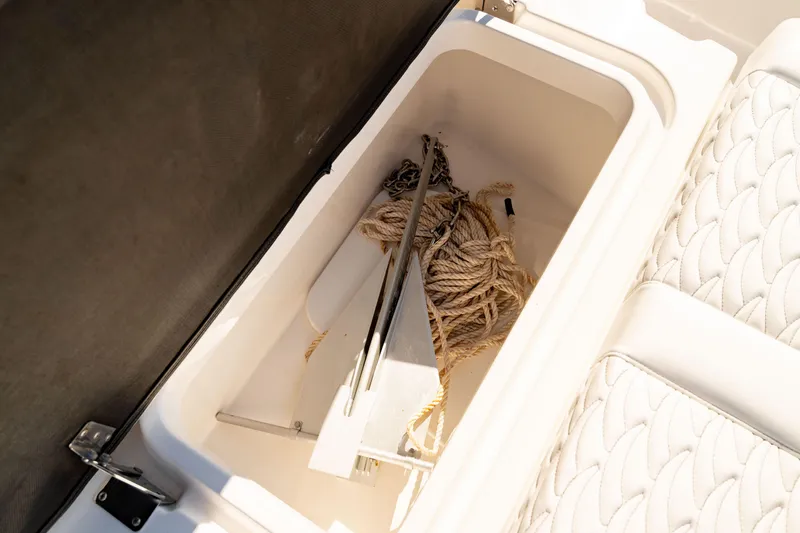 Slide: The Image of Storage compartment with anchor and rope on 2022 Crevalle 33 CSF boat. - 33