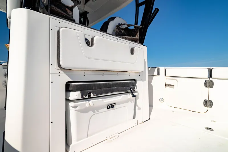 Slide: The Image of 2022 Crevalle 33 CSF boat interior with YETI cooler and seating. - 42