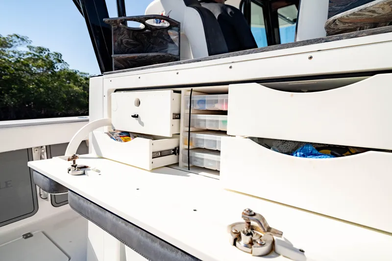 Slide: The Image of 2022 Crevalle 33 CSF boat interior with organized storage compartments. - 43