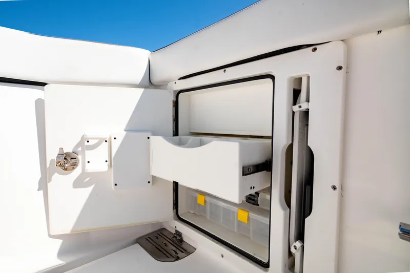 Slide: The Image of Storage compartment on 2022 Crevalle 33 CSF boat, featuring pull-out drawers. - 45