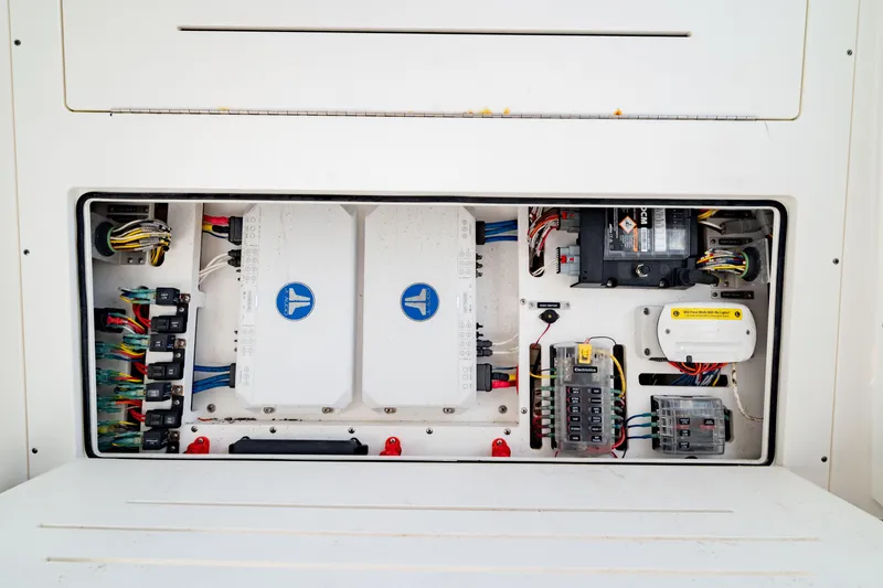 Slide: The Image of Electrical panel of 2022 Crevalle 33 CSF boat, showcasing wiring and components. - 59