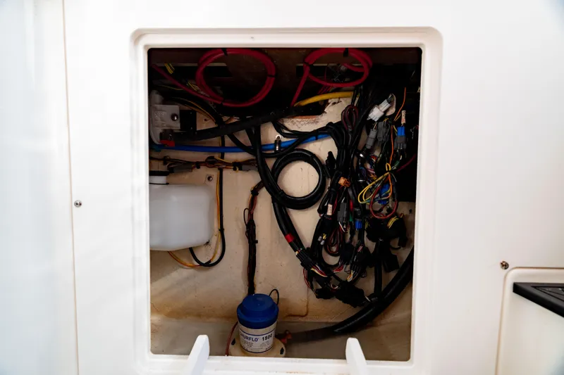 Slide: The Image of Electrical compartment of 2022 Crevalle 33 CSF boat, showcasing wiring and components. - 61