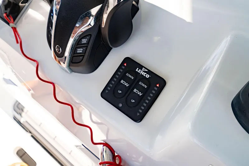 Slide: The Image of Control panel of 2022 Crevalle 33 CSF boat with Lenco trim tab switches. - 67