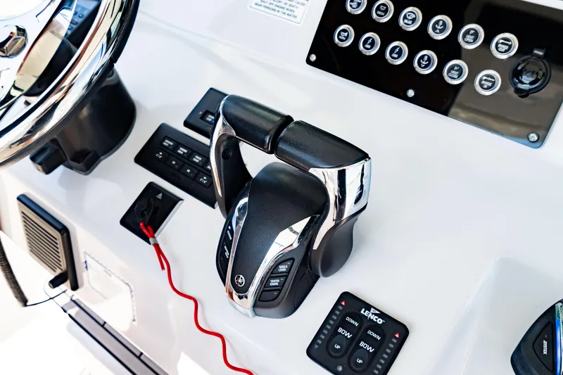 Slide: The Image of Control panel of 2022 Crevalle 33 CSF boat with steering and throttle. - 68