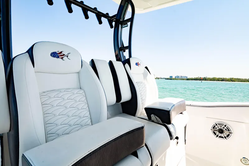 Slide: The Image of 2022 Crevalle 33 CSF boat interior with stylish seating and scenic water view. - 7
