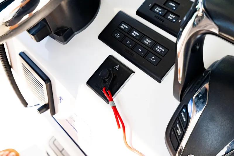 Slide: The Image of 2022 Crevalle 33 CSF boat dashboard with controls and steering wheel. - 71