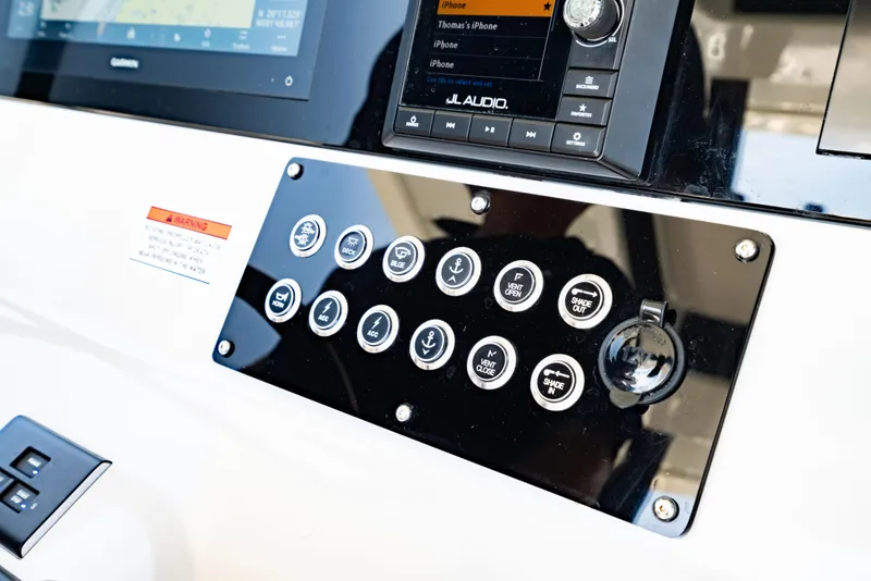 Slide: The Image of Control panel of 2022 Crevalle 33 CSF boat with buttons and display screen. - 72