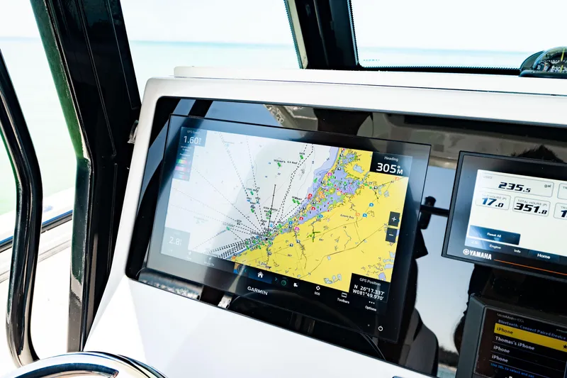 Slide: The Image of 2022 Crevalle 33 CSF boat dashboard with Garmin navigation display. - 74
