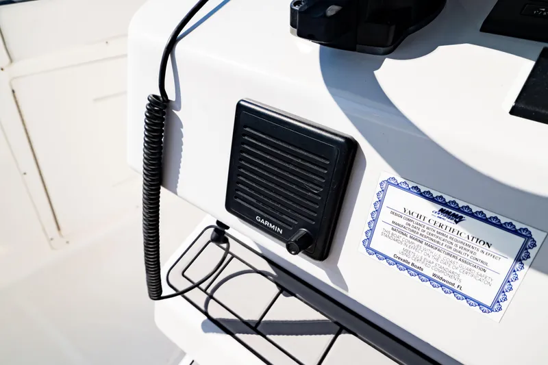 Slide: The Image of 2022 Crevalle 33 CSF boat console with Garmin speaker and yacht certification. - 76