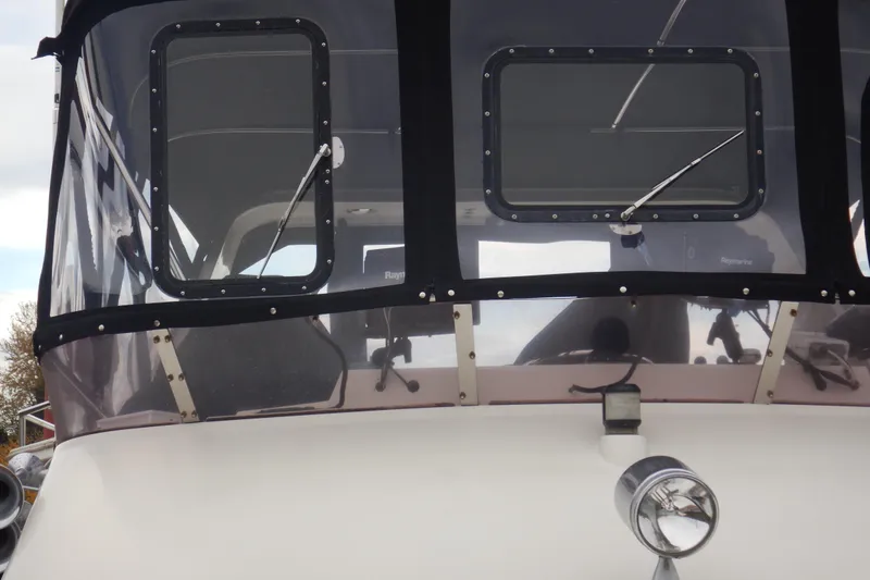 Slide: The Image of 1988 Camargue 48 Cockpit Motor Yacht with enclosed cockpit and windshield wipers. - 13