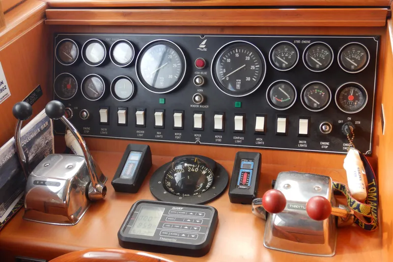 Slide: The Image of Control panel of a 1988 Camargue 48 Cockpit Motor Yacht with gauges and switches. - 20