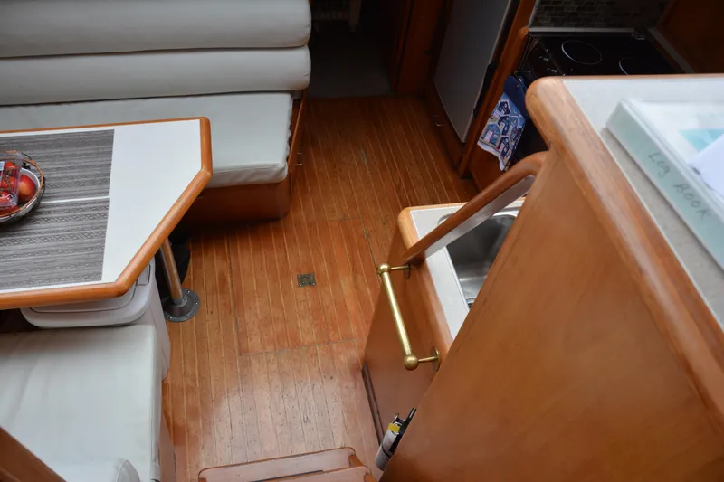 Slide: The Image of Interior of 1988 Camargue 48 Cockpit Motor Yacht with kitchen appliances and wooden cabinetry. - 22