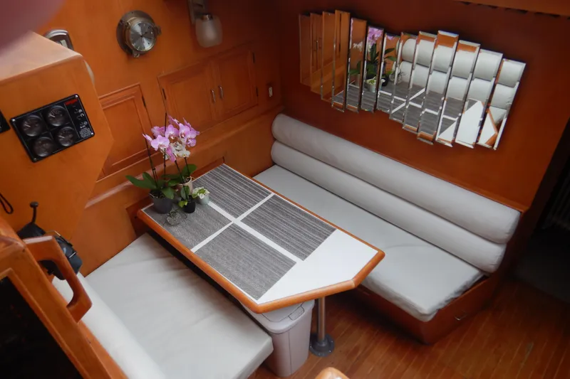 Slide: The Image of Interior of 1988 Camargue 48 Cockpit Motor Yacht with kitchen and seating area. - 24
