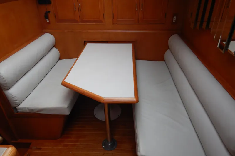 Slide: The Image of 1988 Camargue 48 Cockpit Motor Yacht kitchen with dual sink and wooden cabinetry. - 26