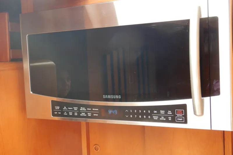 Slide: The Image of 1988 Camargue 48 Cockpit Motor Yacht kitchen sink with dual basins and modern faucet. - 31