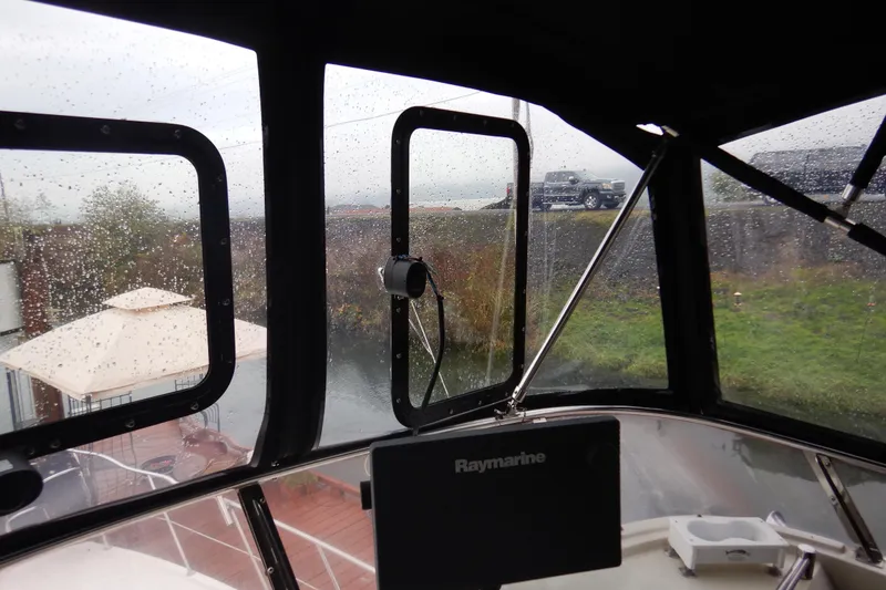 Slide: The Image of Cockpit view of 1988 Camargue 48 Motor Yacht with navigation equipment and radar display. - 55