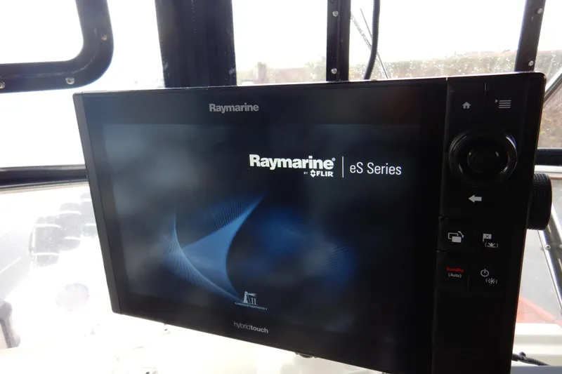 Slide: The Image of Control panel of a 1988 Camargue 48 Cockpit Motor Yacht with gauges and throttle levers. - 59